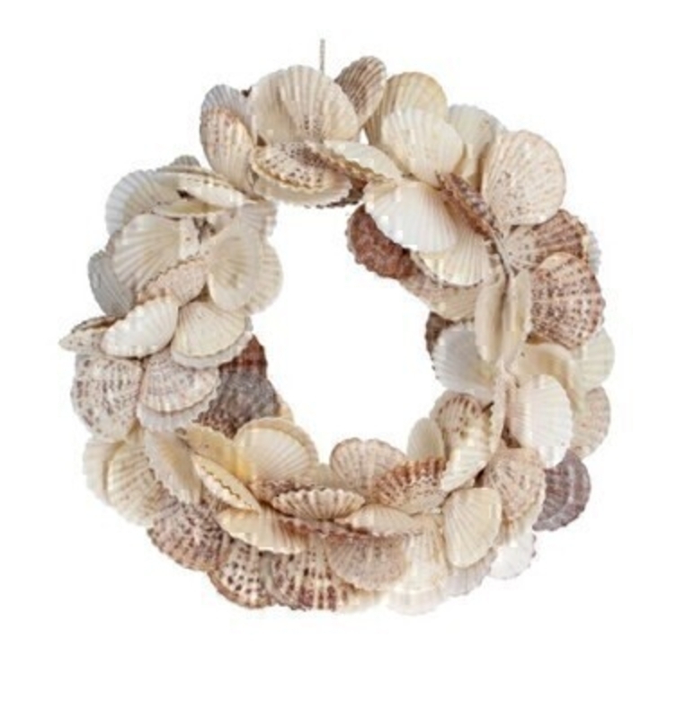 <p>Decorative Shell Door Wreath made from Scallop Shells by designer Gisela Graham. This seashell hanging door wreath is a statement piece all doors deserve. Would make an ideal gift for someone special or as a treat to yourself to hang on your front door or internal door or wall. Also available in different shell designs. Size (LxWxD) 33x33x14cm</p>